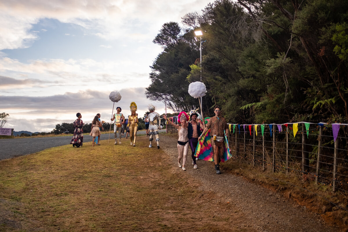Attendees heading down to the beach as the sun sets. Photo: Alex Blackwood.